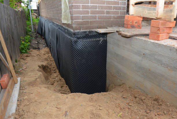 Happy homeowners after waterproofing job in Fostoria